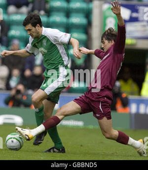 Hibernian's Ian Murray is tackled by Hearts' Deividas Cesnauskis during the Homecoming Scottish Cup match at Easter Road, Edinburgh. Stock Photo