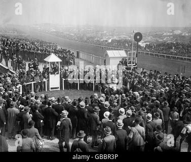 Horse Racing - The Derby Stakes - Epsom - 1932. Tom Walls, the owner, leading in his horse 'April the Fifth' into the unsaddling enclosure after the race. Stock Photo