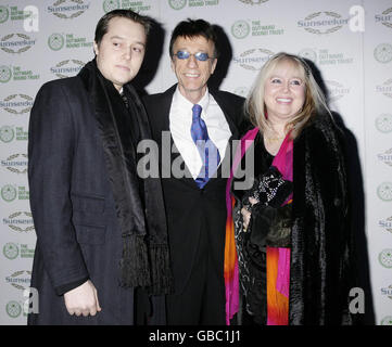 Official ambassador Robin Gibb CBE (centre) with his wife Dwina and son arriving for The Sunseeker International Charitable Trust Ball - in aid of The Outward Bound Trust - at Battersea Evolution in south London. Stock Photo