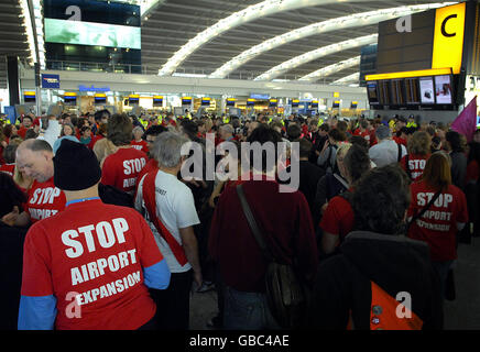 Activists opposed to a third runway at Heathrow Airport today staged a 'flash mob' protest at Terminal Five. Stock Photo