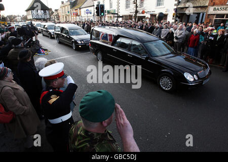 Members of the public line the streets of Wootton Bassett in Wiltshire as the bodies of three British soldiers killed in Afghanistan, Captain Tom Sawyer, 26, of the Royal Artillery, Corporal Danny Winter, 28, of the Royal Marines and Marine Travis Mackin, 22, from Plymouth, were repatriated today. Stock Photo