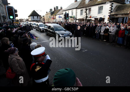 Members of the public line the streets of Wootton Bassett in Wiltshire as the bodies of three British soldiers killed in Afghanistan, Captain Tom Sawyer, 26, of the Royal Artillery, Corporal Danny Winter, 28, of the Royal Marines and Marine Travis Mackin, 22, from Plymouth, were repatriated today. Stock Photo