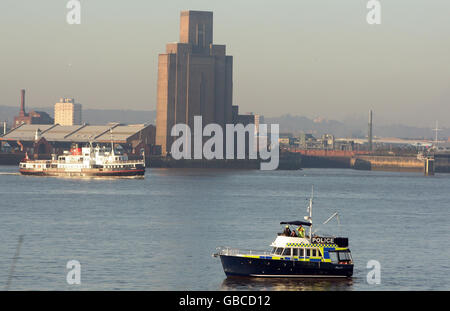 A Police patrol boat sits on the River Mersey ahead of the BT Conference Centre in Liverpool. Stock Photo