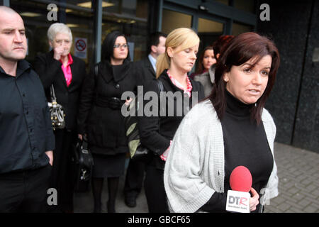 Diane Hamill, sister of murder victim Robert Hamill, arrives with family members at the Interpoint centre in Belfast, for the start of a public inquiry into his death. Stock Photo