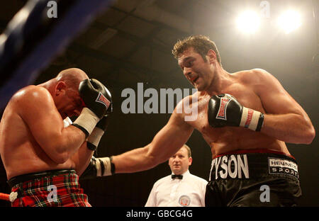 Boxing - British Lightwight Title Fight - John Murray v Lee McAllister - Robin Park Centre. Tyson Fury (right) beats Marcel Zeller on the undercard of the British Lightweight Title fight at the Robin Park Centre, Wigan. Stock Photo