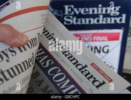 Copies of the Evening Standard newspaper on sale in London. Stock Photo