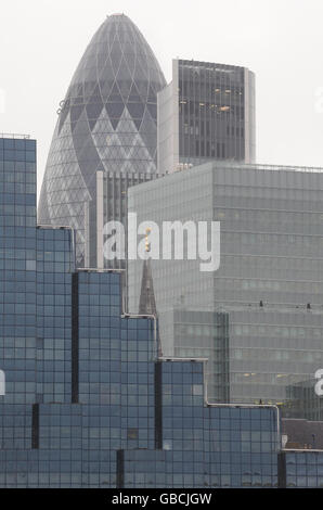 Storm clouds gather over the City of London as official figures today reveal the UK is officially in recession. The economy saw its worst output performance since 1980 in the final three months of 2008. Stock Photo