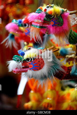 Chinese paraphernalia on sale as lanterns are displayed to celebrate