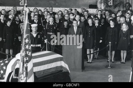 President Richard M. Nixon eulogizes former President Dwight D. Eisenhower in ceremonies March 30 in the Rotunda of the Capitol in Washington, DC. Standing behind Mr. Nixon are Mrs. Mamie Eisenhower, son John, and his wife Barbara. At right are Mrs. Nixon and daughter Tricia. Stock Photo