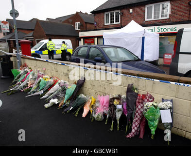 Flowers are left at the scene near Fairfield post office after Craig Hodson-Walker was shot dead during an armed robbery on Friday. Stock Photo