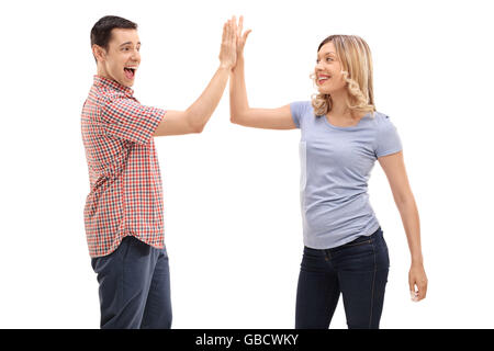 Joyful man and woman greeting each other with a high five isolated on white background Stock Photo