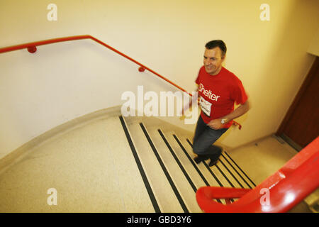 Duncan Bannatyne stands on the first few steps of the stairwell inside Tower 42 in the City of London, as he launches Vertical Rush, an endurance event that challenges people to run up the stairs of the tower in the fastest time possible to raise money for the housing charity Shelter. Stock Photo