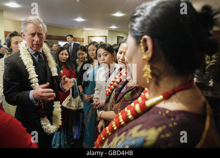 The Prince of Wales (left) talks to families of the 2nd Battalion The Royal Gurkha Rifles (2 RGR), stationed at Sir John Moore Barracks in Folkestone. Stock Photo
