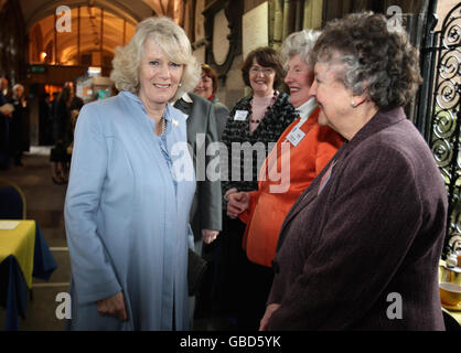 The Duchess of Cornwall (left) meets ladies in a cafe as she tours Hereford Cathedral. Stock Photo