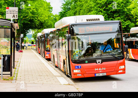 Motala, Sweden -June 21, 2016: Busses waiting to depart from the bus station. Stock Photo