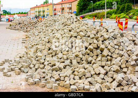 Large pile of cubical granite stones used as pavement on streets and town squares. Stock Photo