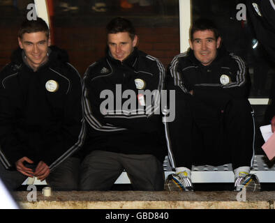Soccer - FA Cup - Fourth Round Replay - Nottingham Forest v Derby County - City Ground. Derby County's manager Nigel Clough (right) in the dugout ahead of the FA Cup, Fourth Round Replay at the City Ground, Nottingham. Stock Photo