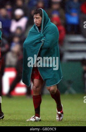 Toulouse's Byron Kelleher keeps warm during an extended break in play from the injury to Michael Lipman during the Heineken Cup match at The Recreation Ground, Bath. Stock Photo