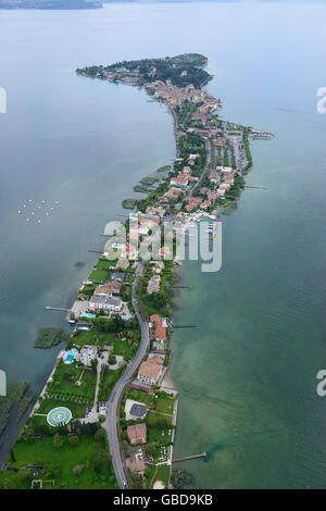 AERIAL VIEW. Surprisingly long and narrow peninsula on the southern shore of Lake Garda. Sirmione, Province of Brescia, Lombardy, Italy.