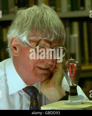 Dr Ian Edwards of the University of Newcastle with an early carbon filament light bulb from the early 1900s, as the search is launched to discover the oldest light bulb still glowing strong in a British home, at the Literary and Philosophical Society, Westgate Road, Newcastle-upon-Tyne. Stock Photo