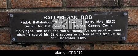 Plaque by the side of the statue of Ballyregan Bob at Brighton and Hove Greyhound Stadium. Stock Photo