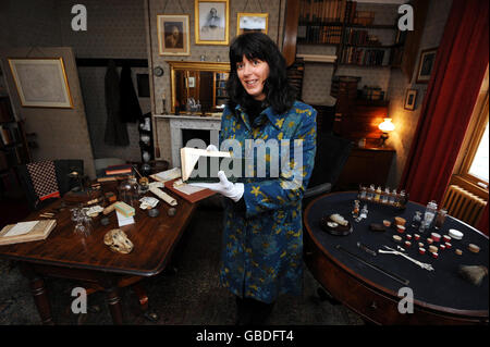 The great, great grand daughter of Charles Darwin, botanist Sarah Darwin, in his study at Down House, Kent, holding, for the first time, an 1859 first edition of his pioneering natural history text, The Origin of Species. English Heritage have created a new exhibition at the house, which includes many unseen exhibits, to mark the 200th anniversary of his birth on February 12th which opens to the public on February 13th. Stock Photo