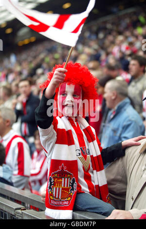 A Sunderland fan soaks up the atmosphere at Old Trafford Stock Photo