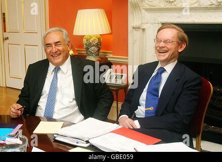 World Bank President Robert Zoellick (right) and International Monetary Fund Chief Dominique Strauss-Kahn (left) attend a meeting with Prime Minister Gordon Brown and Chancellor Alistair Darling at 10 Downing Street, London. Stock Photo