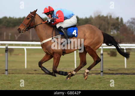 Callitwhatyalike ridden by jockey Tom Messenger during The Marketrasenraces.co.uk Maiden Hurdle Race (Class 4) Stock Photo