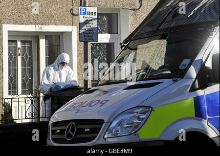 Police forensics officers at the scene on Commercial Street in Ystrad Mynach, Caerphilly, Wales, where a three-and-a-half-month-old baby boy was mauled to death by two family owned dogs around midnight last night. Stock Photo