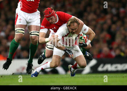 Wales Alun Wyn Jones tackles England's Owen Farrell during the RBS 6 ...