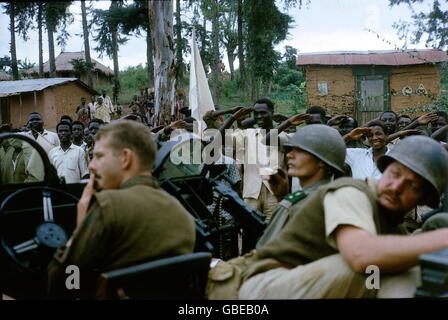 geography / travel, Congo, Simba uprising 1964 - 1965, natives with flag of truth saluting the mercenaries, December 1964, Additional-Rights-Clearences-Not Available Stock Photo