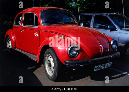 transport / transportation, car, vehicle variants, Volkswagen, red VW Beetle 1300, side view from ahead, Germany, circa 1990, motor car, auto, automobile, passenger car, motorcar, motorcars, autos, automobiles, passenger cars, parking, antenna, antennae, antennas, bumper, bumper bar, bumpers, bumper bars, bow, bows, front, fronts, headlight, 1990s, 90s, 1980s, 80s, 20th century, transport, transportation, car, cars, beetle, bug, beetles, bugs, historic, historical, Additional-Rights-Clearences-Not Available Stock Photo