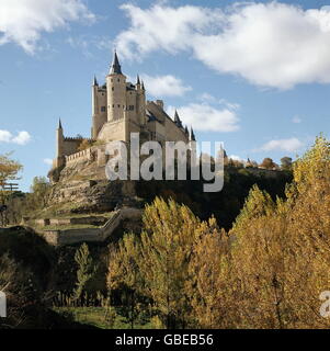 geography / travel,Spain,Segovia,Alcazar,built by the Moorish in the early 12th century,last modification in the late 16th century,view from West,in front: treasure tower,middle: tower of King Johann II,Old Castile,Castile,Reconquista,Middle Ages,royal palace,kingly residence,royal residence,treasury,treasure house,treasuries,military academy,Gothic style,Gothic period,fortress,fortresses,merlon,merlons,historic,historical,Sierra Guadarrama,world cultural heritage,world heritage list,South Western Europe,Southern Europe,Western ,Additional-Rights-Clearences-Not Available Stock Photo