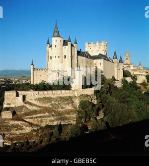 geography / travel,Spain,Segovia,Alcazar,built by the Moorish in the early 12th century,last modification in the late 16th century,view from Southwest,in front: treasure tower,middle: tower of King Johann II,Old Castile,Castile,Reconquista,Middle Ages,royal palace,kingly residence,royal residence,treasury,treasure house,treasuries,military academy,Gothic style,Gothic period,fortress,fortresses,merlon,merlons,historic,historical,Sierra Guadarrama,world cultural heritage,world heritage list,South Western Europe,Southern Europe,Wes,Additional-Rights-Clearences-Not Available Stock Photo