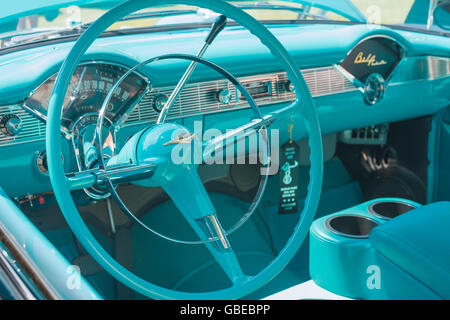 Steering wheel and instrument panel of a turquoise 1957 Chevrolet Bel Air car. Stock Photo