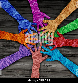 Diverse people team joining hands together as a partnership teamwork concept as a group of paper cut out hands as a diversity collaboration symbol in a 3D illustration style. Stock Photo