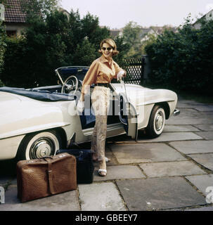 people, women, lady with her Mercedes Benz convertible, suitcase