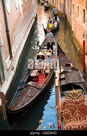 tourists, gondolier, gondola, gondolas, canal, Venice, Venezia, Veneto, Italy Stock Photo