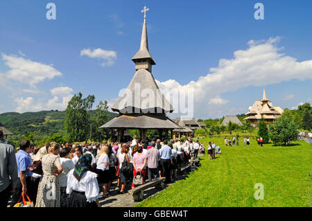 Wooden church, visitors, Barsana, monastery, Maramures, Romania Stock Photo