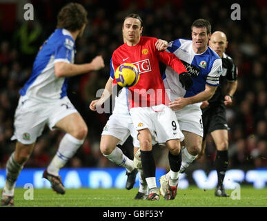 Manchester United's Dimitar Berbatov (left) and Blackburn Rovers' Ryan Nelsen battle for the ball during the Barclays Premier League match at Old Trafford, Manchester. Stock Photo