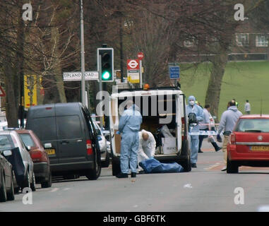 A police forensic team at the scene of a shooting on Barry Road, in south-east London. Stock Photo