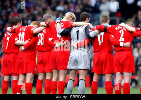 (L-R) Liverpool's Harry Kewell, John Arne Riise, Bruno Cheyrou, Sami Hyypia, Jerzy Dudek, Steven Gerrard and Stephane Henchoz observe the minutes silence in honour of the 15 year anniversary of the Hillsborough disaster Stock Photo