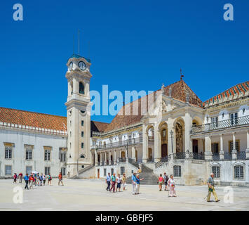 Coimbra, Portugal - June 21, 2016. Tourists crossing Patio das Escolas courtyard of the Coimbra University. Portugal. Stock Photo