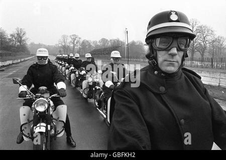 Black-helmeted Chief Inspector John Baldwin, of Traffic Division (foreground, right), the team leader of the Special Escort Group of the Metropolitan Police, is shown with the team during a practise stint at the Crystal Palace motor-racing circuit, London. Stock Photo
