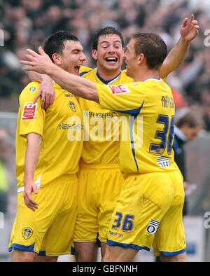 Leeds United's Robert Snodgrass (left) celebrates scoring his sides second goal with teammates Ben Parker (centre) and Richard Naylor (right) Stock Photo