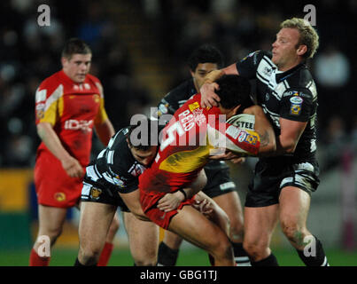 Hull FC's Tommy Lee and Jamie Thackray (right) combine to bring down Catalans Dragons' Dimitri Pelo (centre) during the engage Super League match at the KC Stadium, Hull. Stock Photo