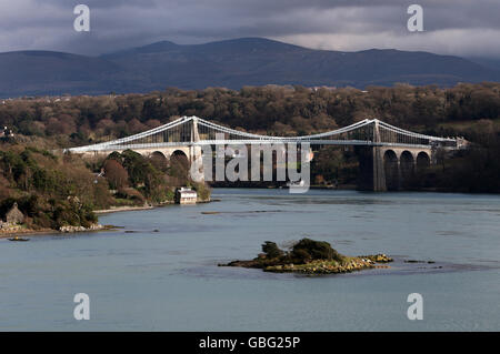 Menai Suspension bridge which spans the Menai Strait between Anglesey and the mainland of north Wales. Designed by Thomas Telford and completed in 1826. Stock Photo