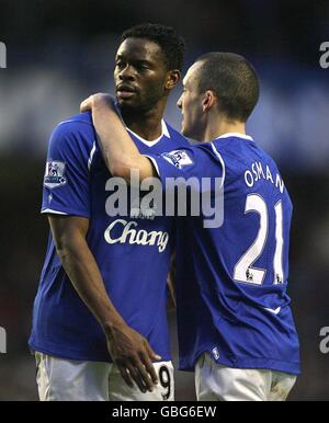 Everton's Louis Saha and Leon Osman after the final whistle. Stock Photo