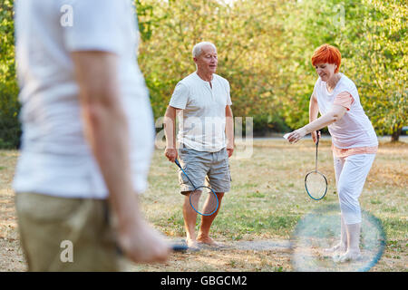 Active seniors playing in the park and having fun Stock Photo